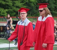 students walking into ceremony