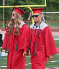 students walking into ceremony