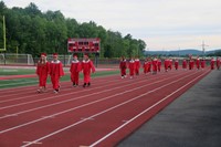 students walking into ceremony