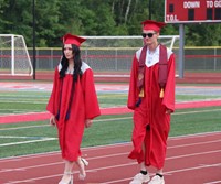 students walking into ceremony