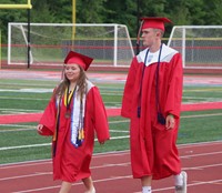 students walking into ceremony