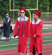 students walking into ceremony