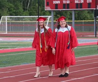 students walking into ceremony