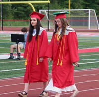 students walking into ceremony