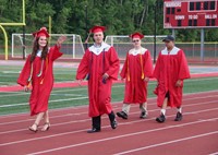 students walking into ceremony