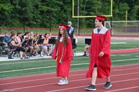 students walking into ceremony