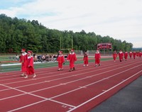 students walking into ceremony