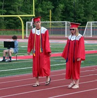 students walking into ceremony