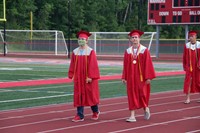 students walking into ceremony