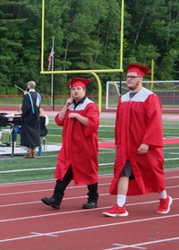 students walking into ceremony