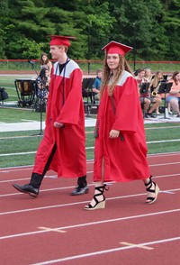 students walking into ceremony