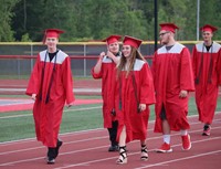 students walking into ceremony