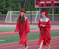 students walking into ceremony