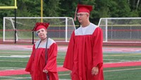 students walking into ceremony