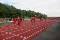 students walking into ceremony