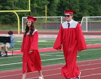 students walking into ceremony