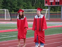 students walking into ceremony