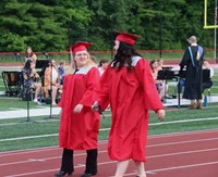 students walking into ceremony