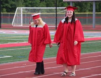 students walking into ceremony