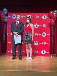 principal and student at moving up ceremony