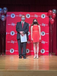 principal and student at moving up ceremony