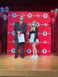 principal and student at moving up ceremony