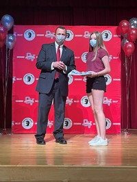 principal and student at moving up ceremony