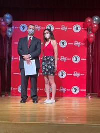 principal and student at moving up ceremony