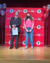 principal and student at moving up ceremony