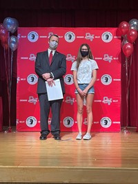 principal and student at moving up ceremony