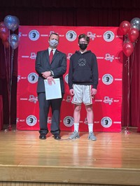 principal and student at moving up ceremony