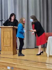 student receiving certificate