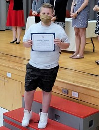 student at fifth grade ceremony