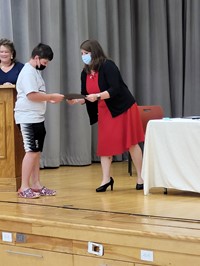 student getting certificate