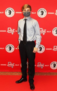 student posing on red carpet