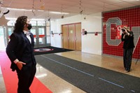 student posing on red carpet