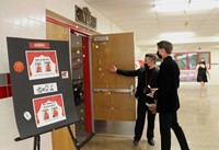 student entering auditorium