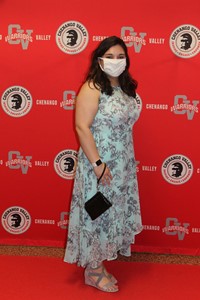 student posing on red carpet