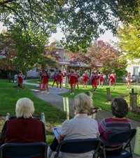 medium shot of pep rally at nursing home