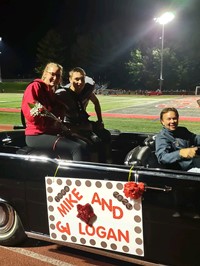 Homecoming Court Candidates in Car at Football Game