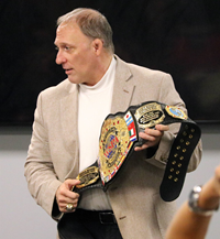 Mr. Clark showing students professional strongman belt