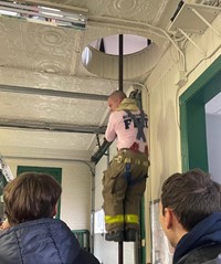 students watching fire fighter