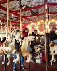 students at recreation park on carousel