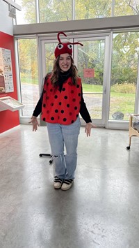 student in lady bug costume at Ithaca Museum