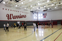 students playing volleyball