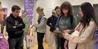 students looking at exhibit items