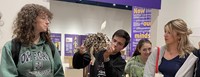 Students looking at Roberson Museum exhibit item