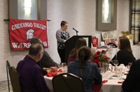 Student introducing Peg Peters at Alumni Recognition Event