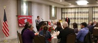 wide shot of Student introducing Peg Peters at Alumni Recognition Event