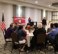 Merissa Kraham Velez speaking at alumni recognition event